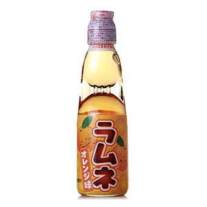 Hatakousen Orange Ramune Soda in the classic codd-neck glass bottle. A delicious and refreshing Japanese drink! Available at Sweetie Kawaii!